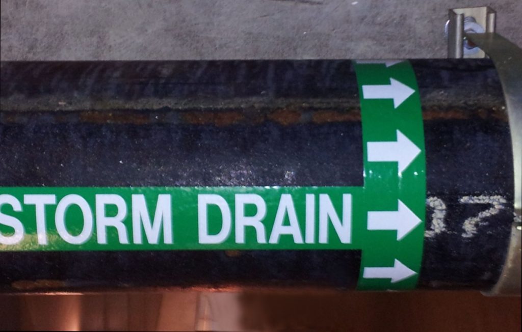 Storm drain label to illustrate pipe marking labels.